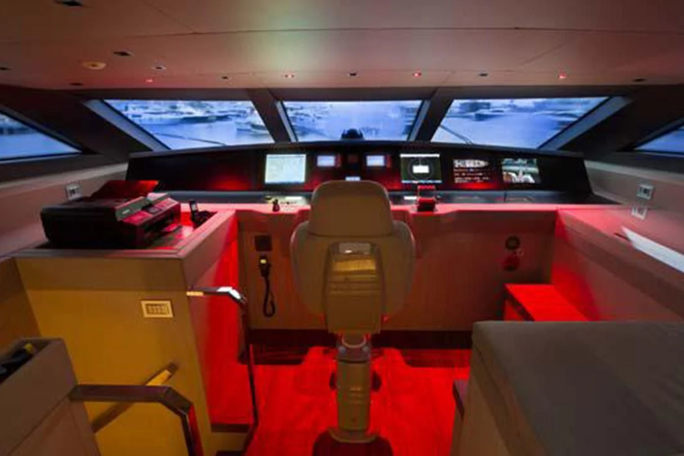 a yellow and orange chair in a bus aboard INDIGO Yacht for Sale
