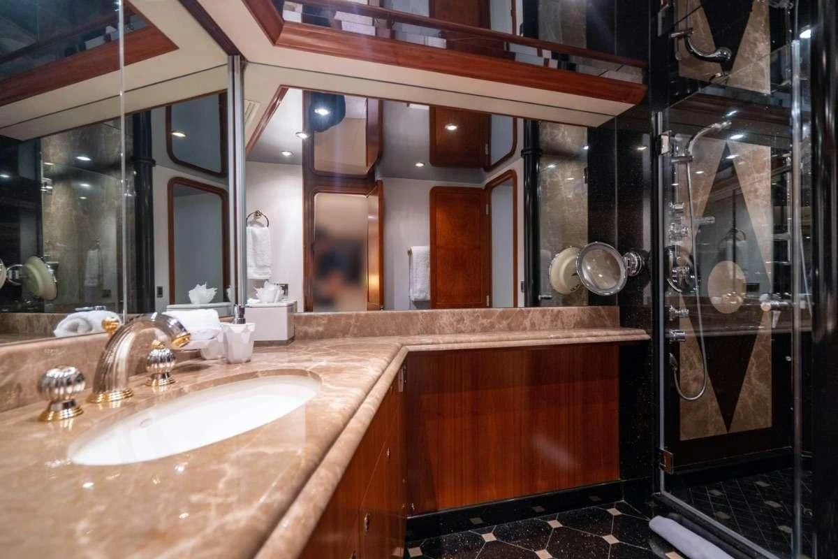 a bathroom with a sink and cabinets aboard INDIGO Yacht for Sale