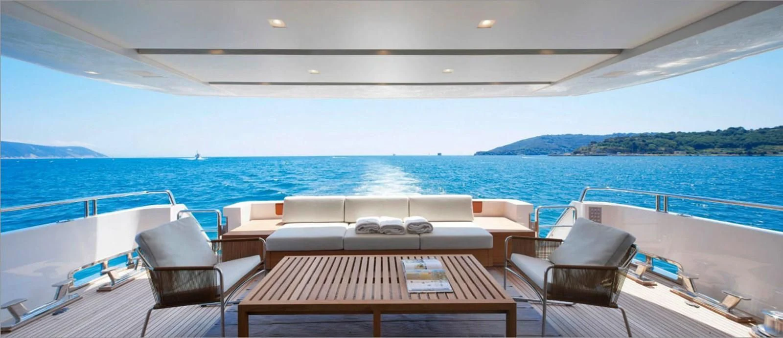 a table and chairs on a boat aboard INDIGO Yacht for Sale