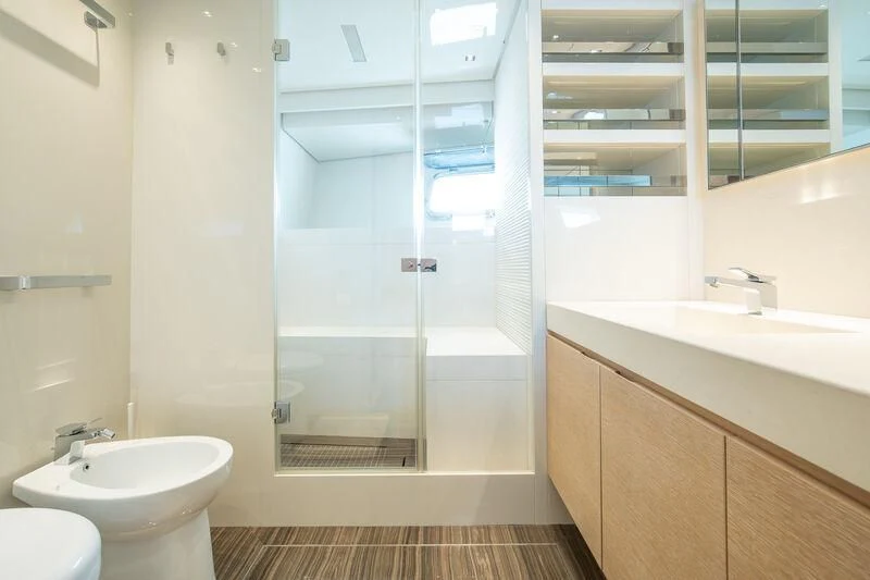a bathroom with a glass shower aboard INDIGO Yacht for Sale