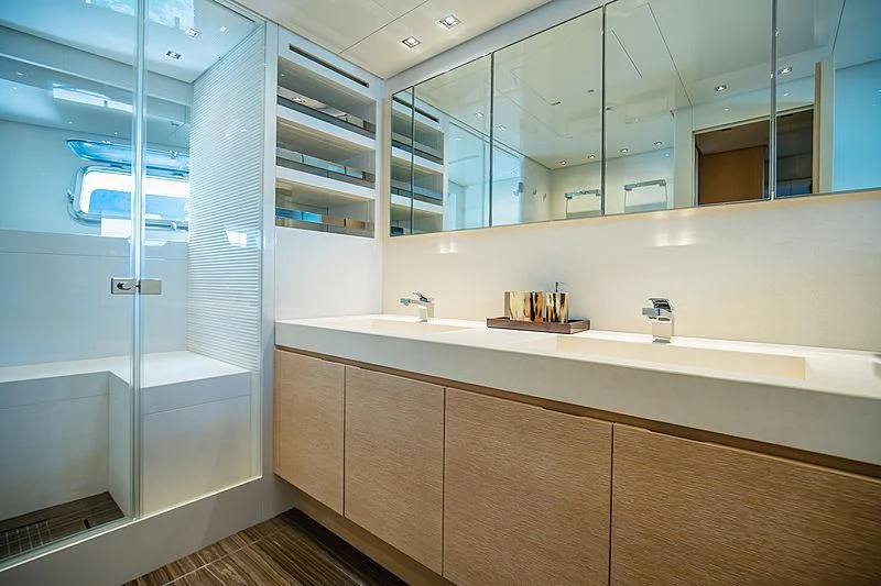 a bathroom with a glass shower aboard INDIGO Yacht for Sale