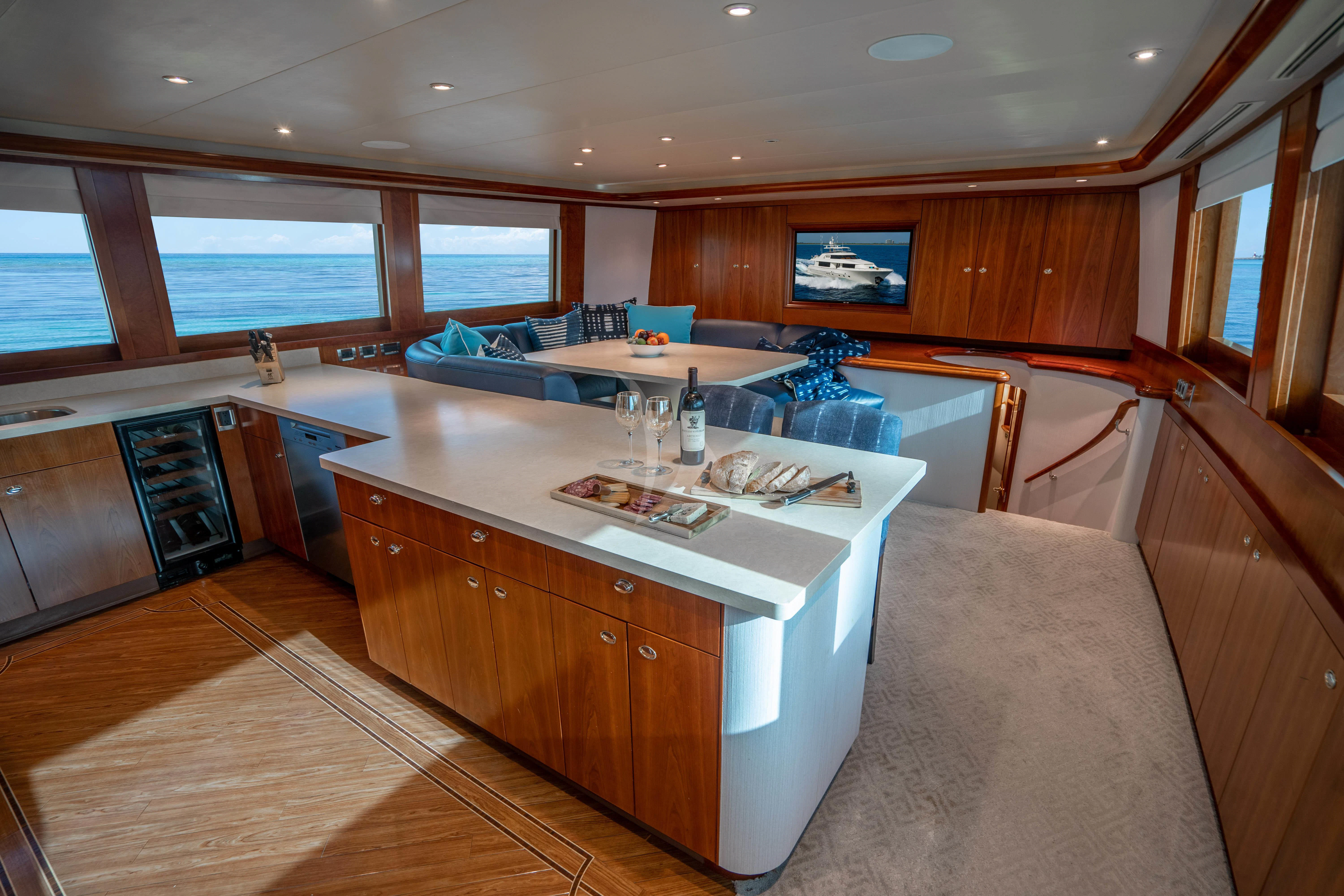a room with a couch and a table aboard INDIGO Yacht for Sale
