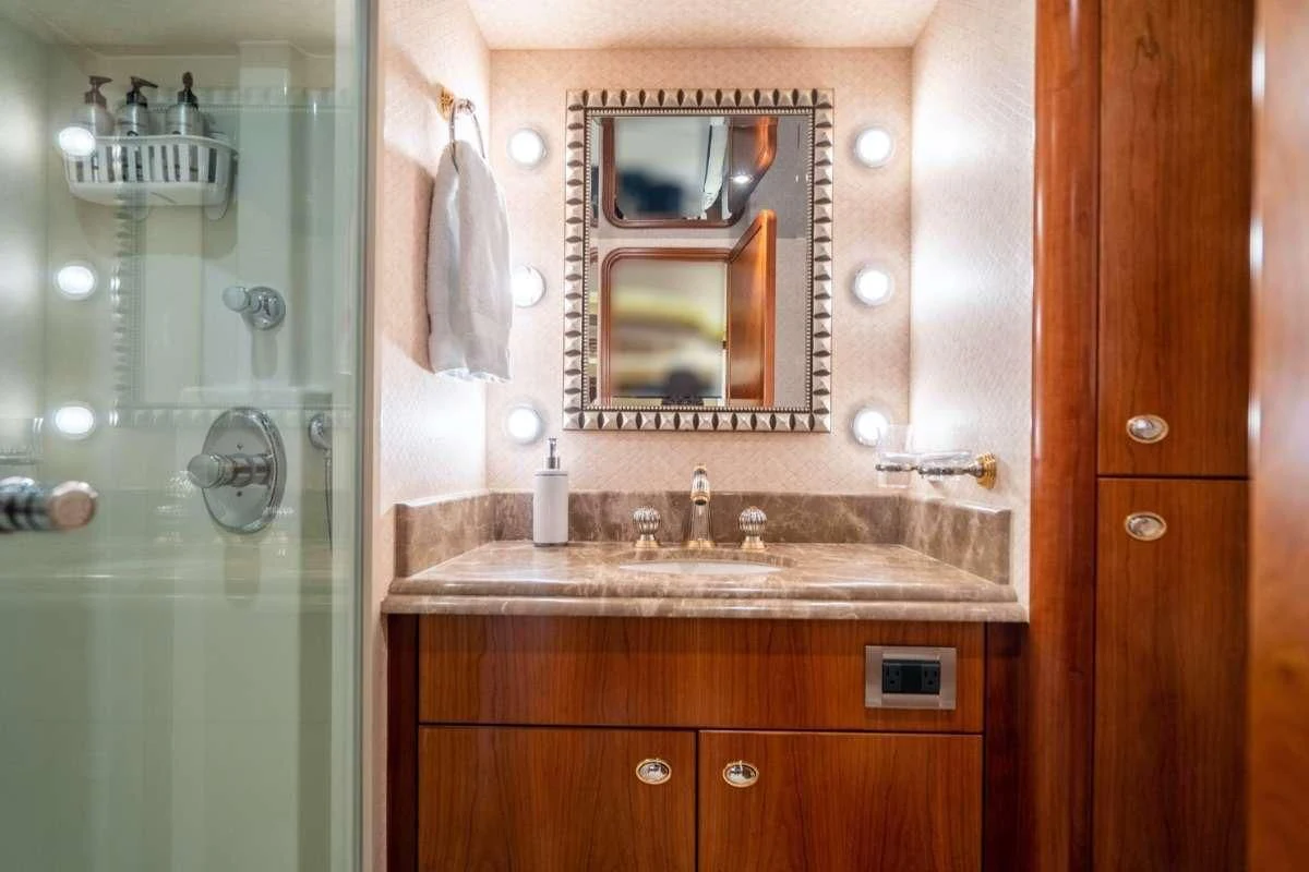 a bathroom with a glass shower aboard INDIGO Yacht for Sale
