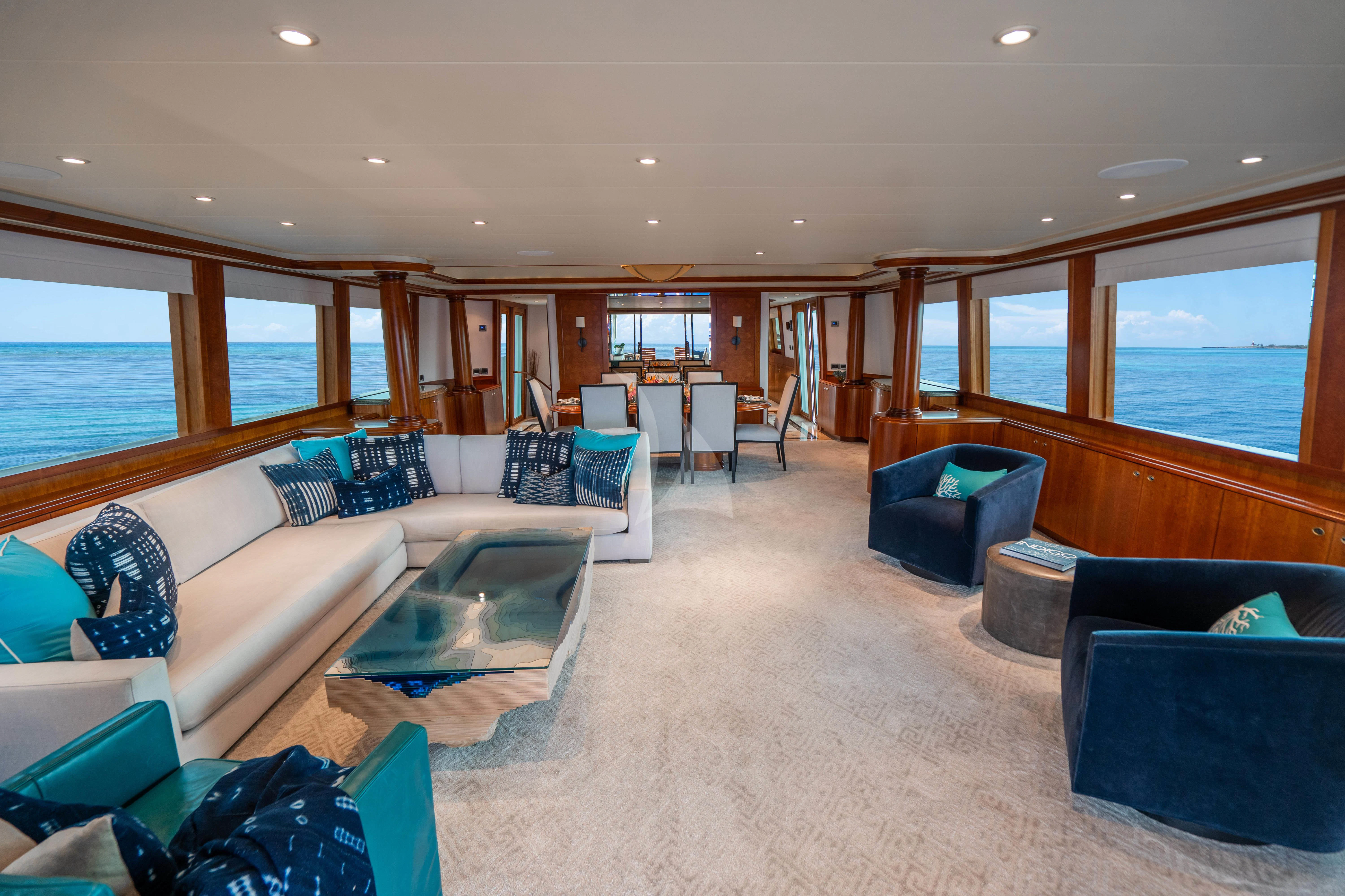 a living room with a large window aboard INDIGO Yacht for Sale