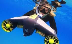 a person in scuba gear underwater aboard INDIGO Yacht for Sale