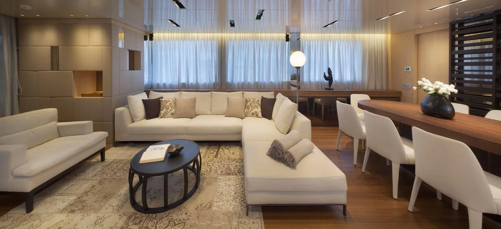 a living room with a couch and a table aboard INDIGO Yacht for Sale