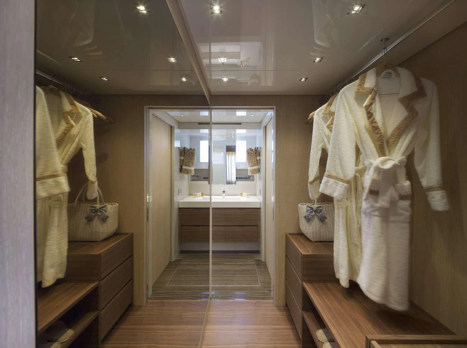 a room with a closet and clothes on the wall aboard INDIGO Yacht for Sale