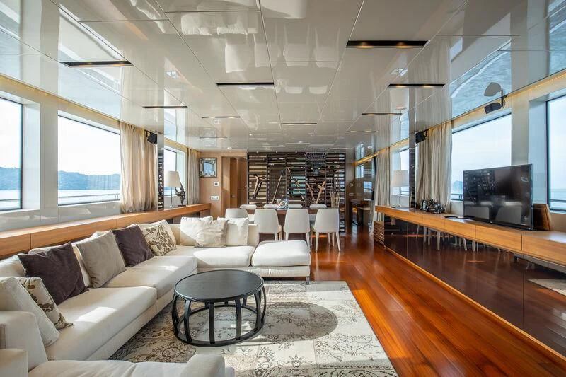 a living room with a large window aboard INDIGO Yacht for Sale
