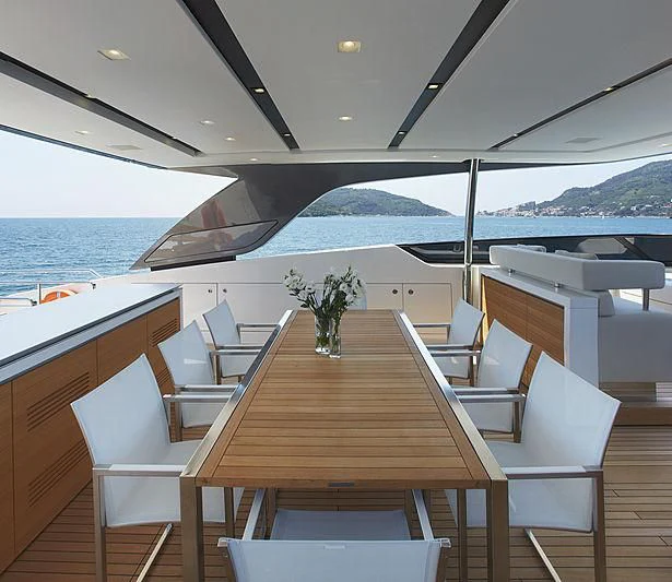 a wooden table on a boat aboard INDIGO Yacht for Sale