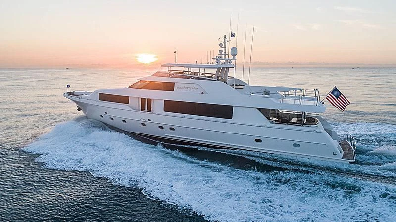 a large white ship in the water aboard INDIGO Yacht for Sale