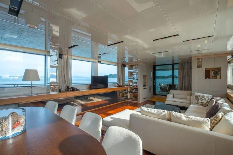 a living room with a large window aboard INDIGO Yacht for Sale