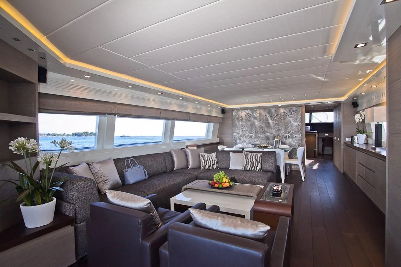 a living room with a large window aboard DADDY'S DREAM 888 Yacht for Charter