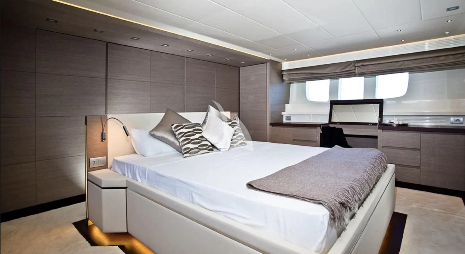 a room with a bed and a desk aboard DADDY'S DREAM 888 Yacht for Charter