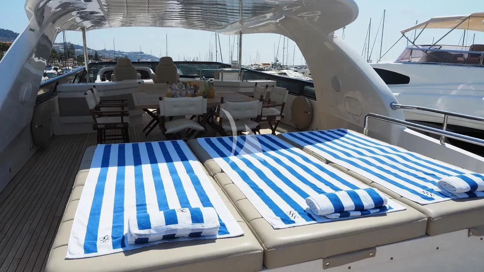 a deck with chairs and tables aboard DADDY'S DREAM 888 Yacht for Charter