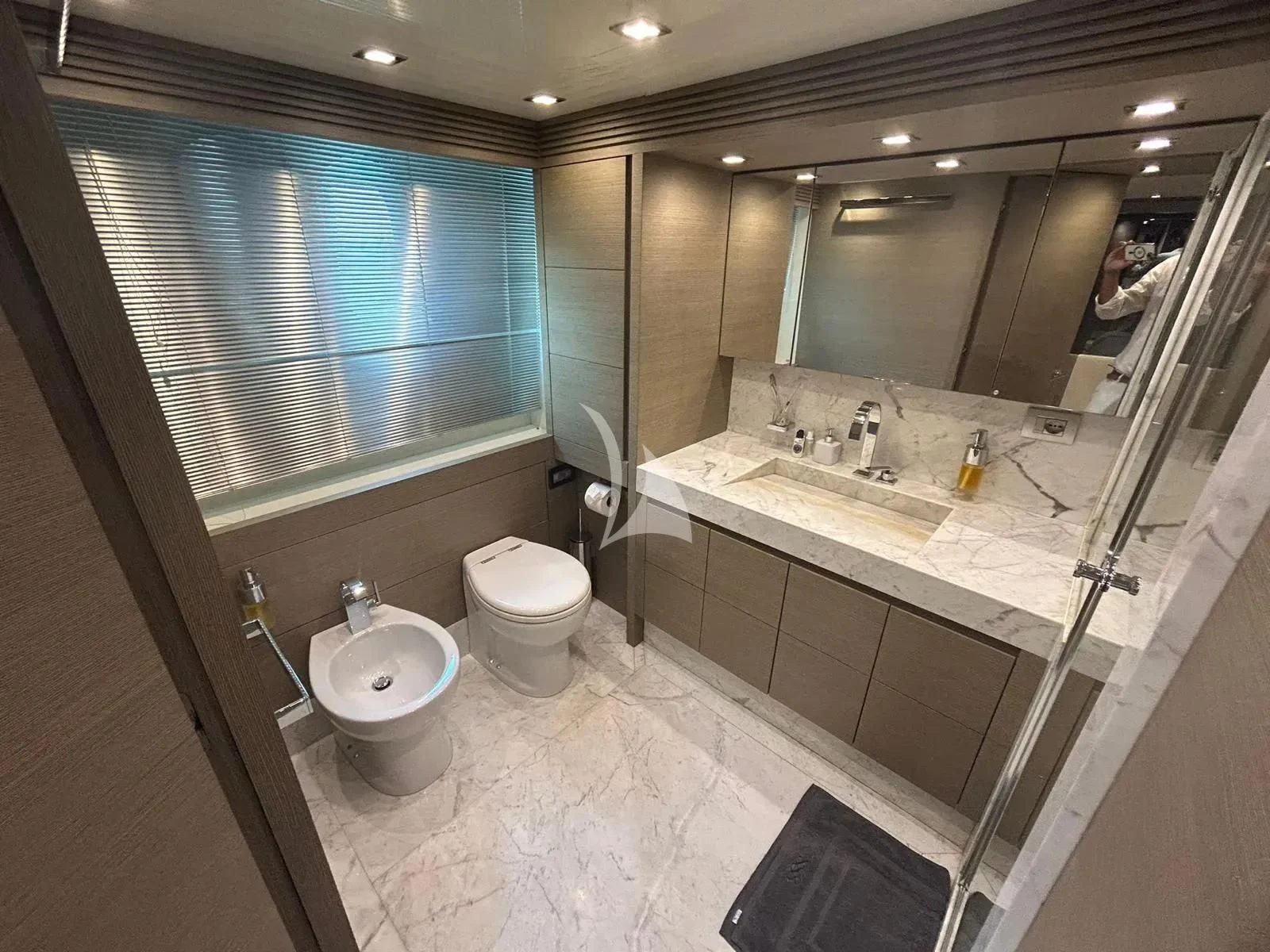 a bathroom with a sink and a toilet aboard DADDY'S DREAM 888 Yacht for Charter