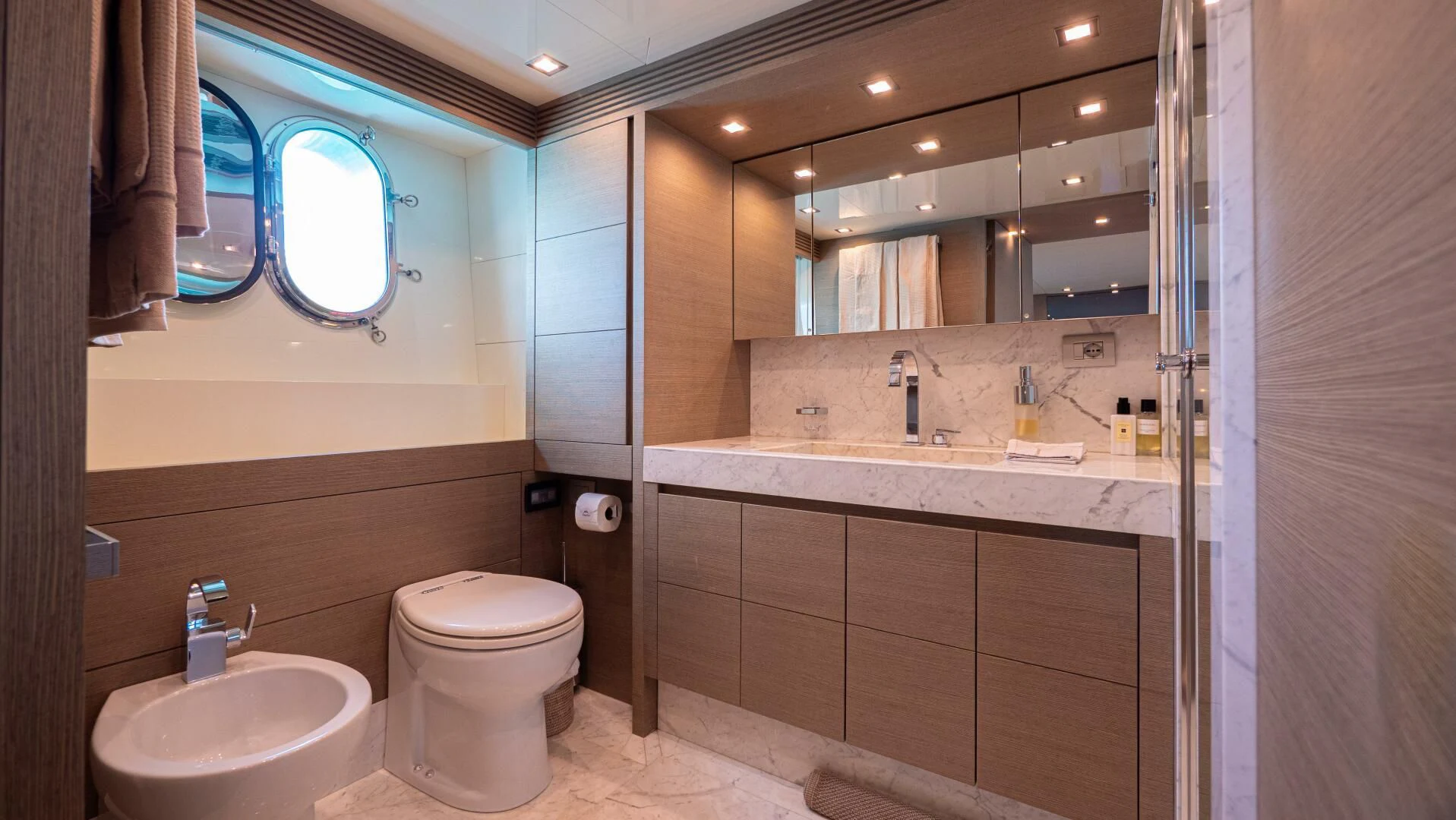 a bathroom with a large mirror aboard DADDY'S DREAM 888 Yacht for Charter