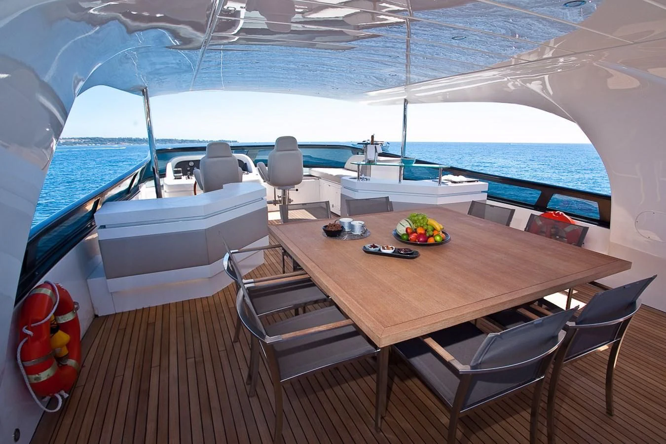 a table on a deck aboard DADDY'S DREAM 888 Yacht for Charter