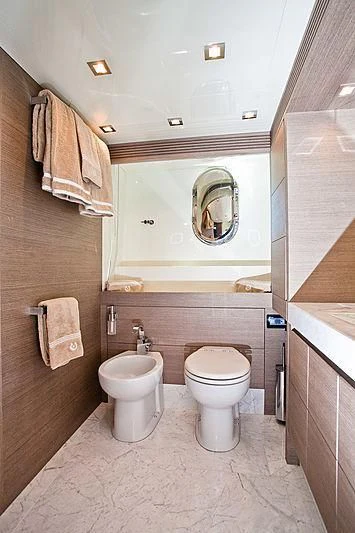 a bathroom with a toilet and a sink aboard DADDY'S DREAM 888 Yacht for Charter