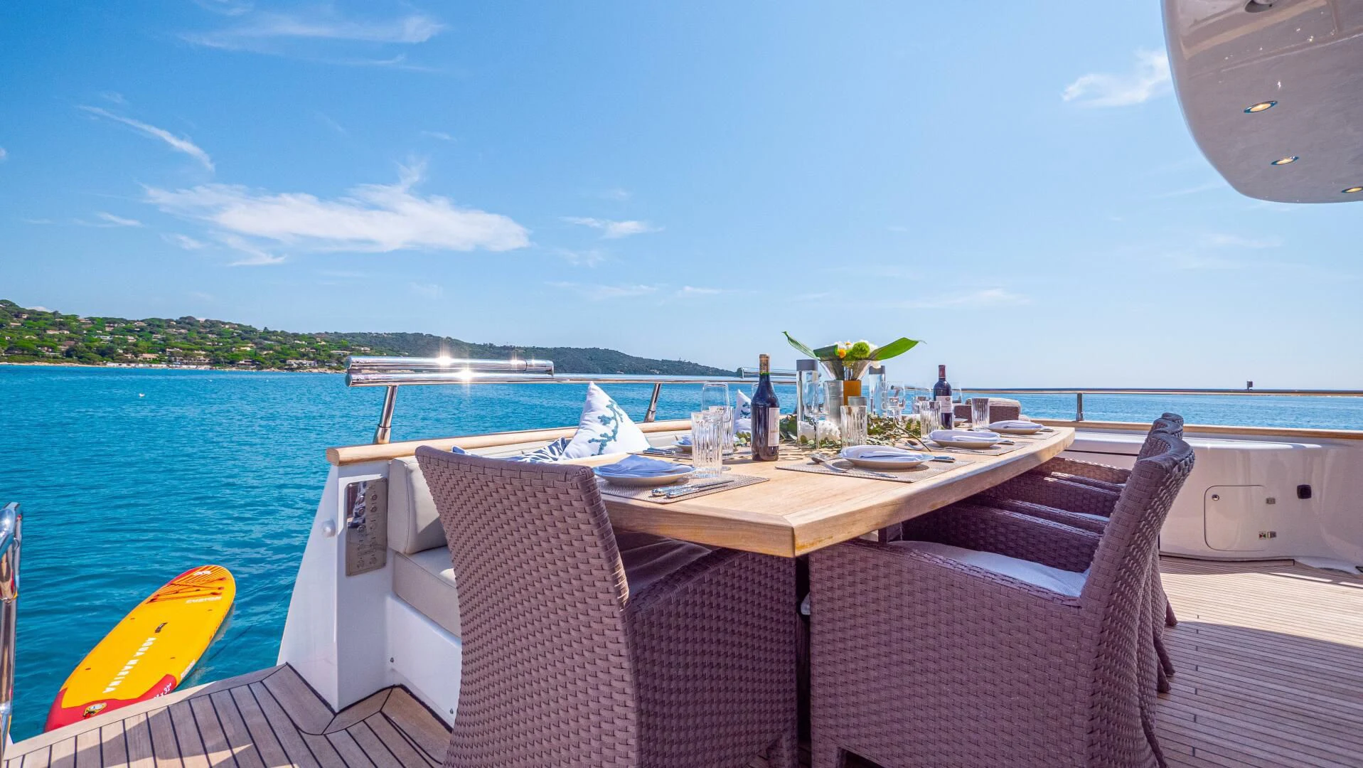 a table and chairs on a boat aboard DADDY'S DREAM 888 Yacht for Charter