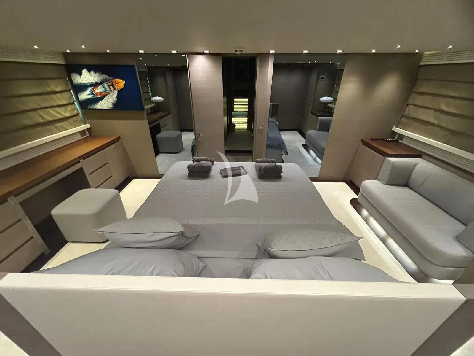 a room with a bed and a tv on the wall aboard DADDY'S DREAM 888 Yacht for Charter