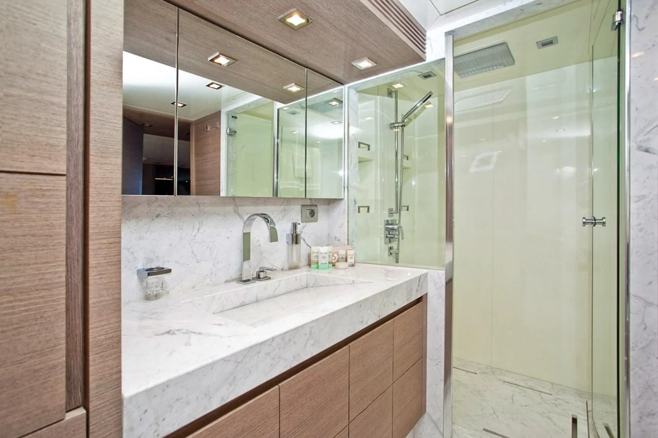 a bathroom with a large mirror aboard DADDY'S DREAM 888 Yacht for Charter