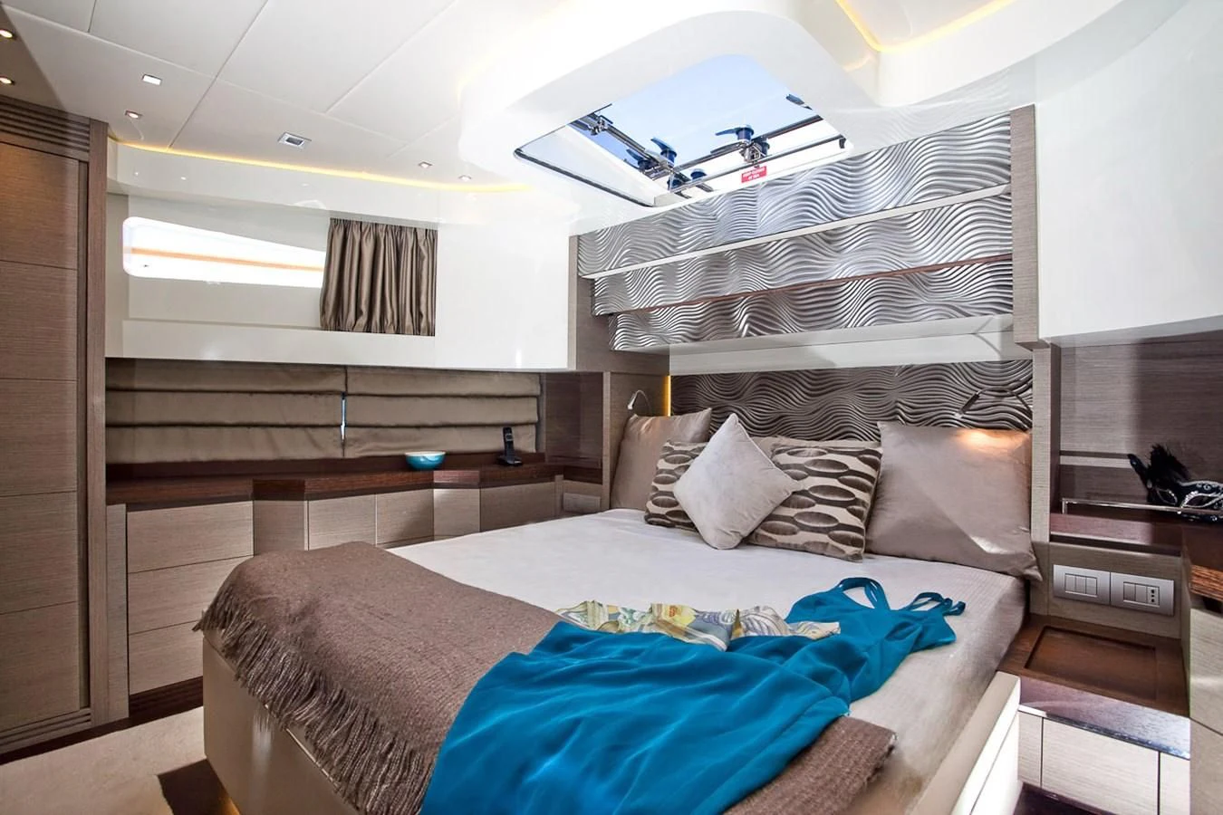 a bedroom with a bed and a bunk bed aboard DADDY'S DREAM 888 Yacht for Charter