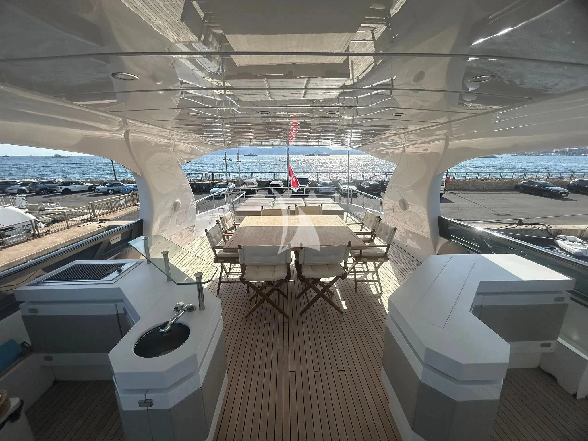 a room with tables and chairs aboard DADDY'S DREAM 888 Yacht for Charter