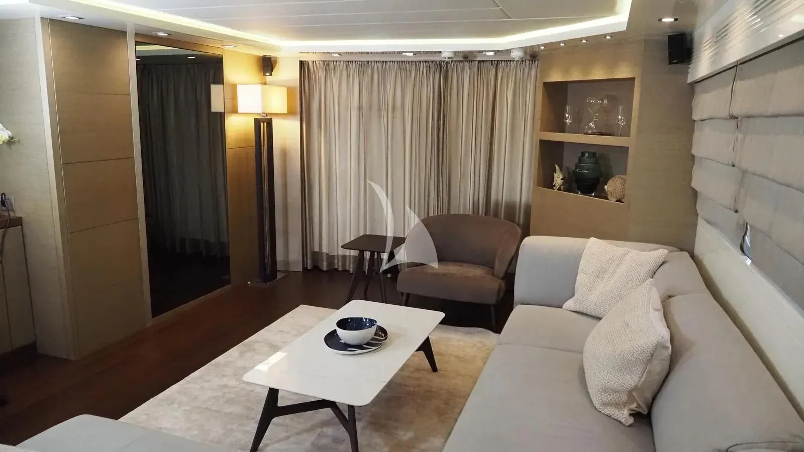 a room with a couch and a table aboard DADDY'S DREAM 888 Yacht for Charter