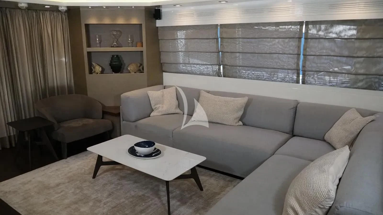 a living room with a couch and a coffee table aboard DADDY'S DREAM 888 Yacht for Charter