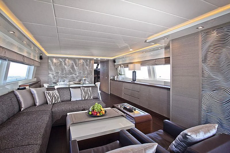 a living room with a couch and a table aboard DADDY'S DREAM 888 Yacht for Charter