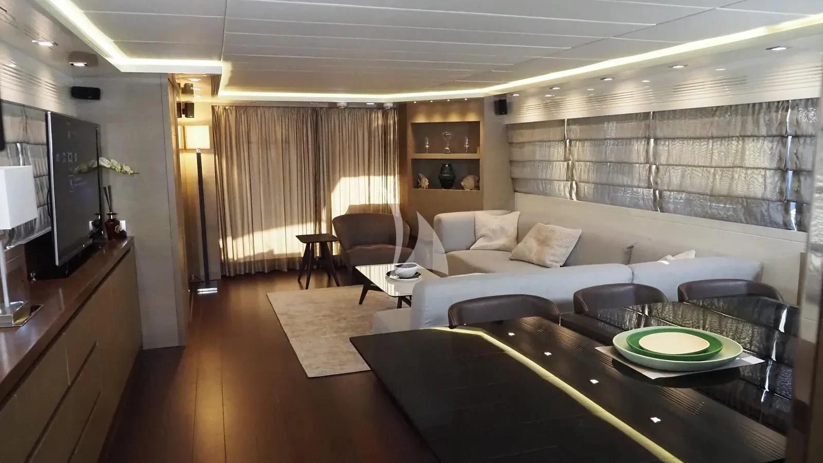 a living room with a large window aboard DADDY'S DREAM 888 Yacht for Charter