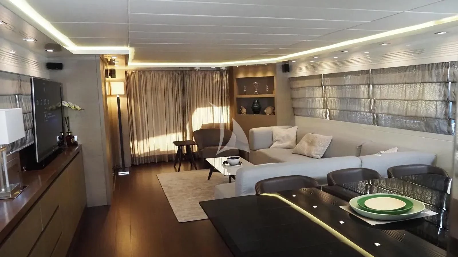 a living room with a large window aboard DADDY'S DREAM 888 Yacht for Charter