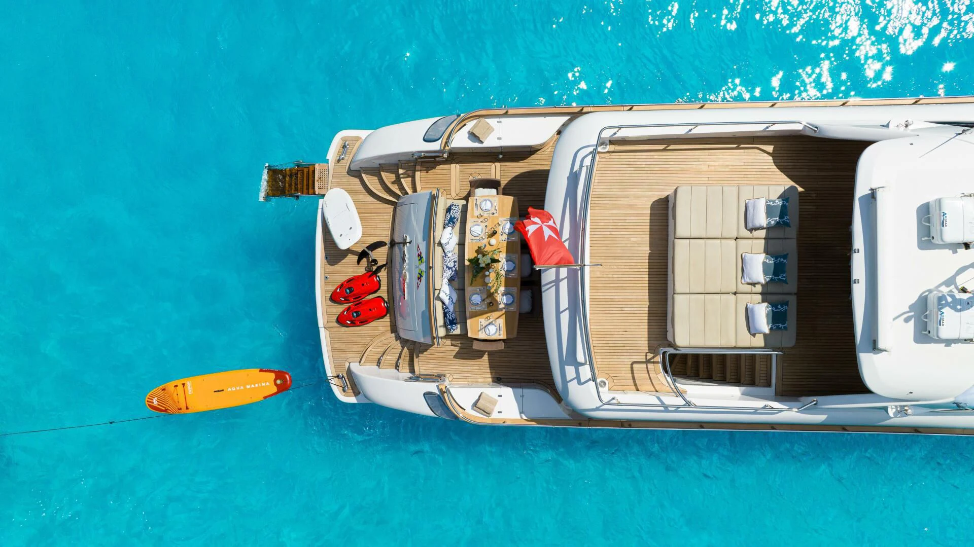 a boat with a large boat on it aboard DADDY'S DREAM 888 Yacht for Charter