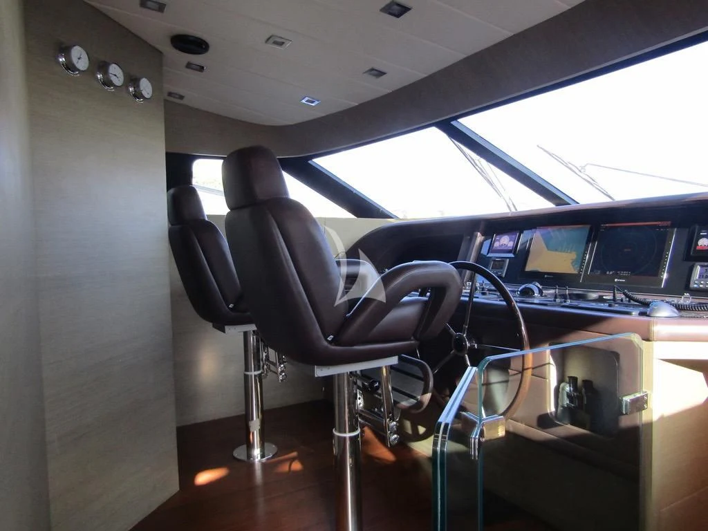 a room with a chair and a desk with a computer on it aboard DADDY'S DREAM 888 Yacht for Charter