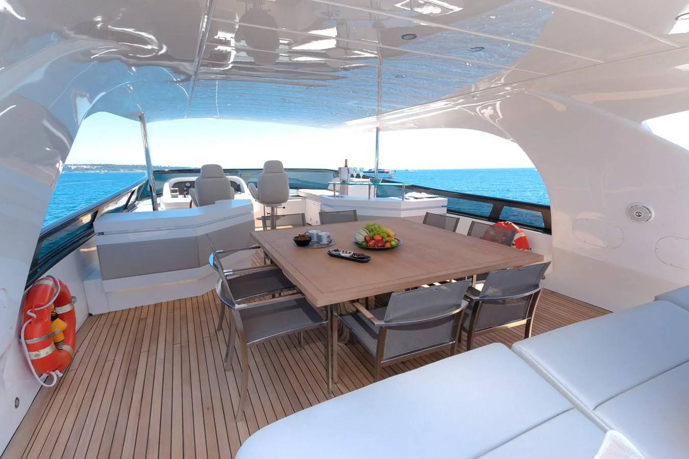 a room with a table and chairs aboard DADDY'S DREAM 888 Yacht for Charter
