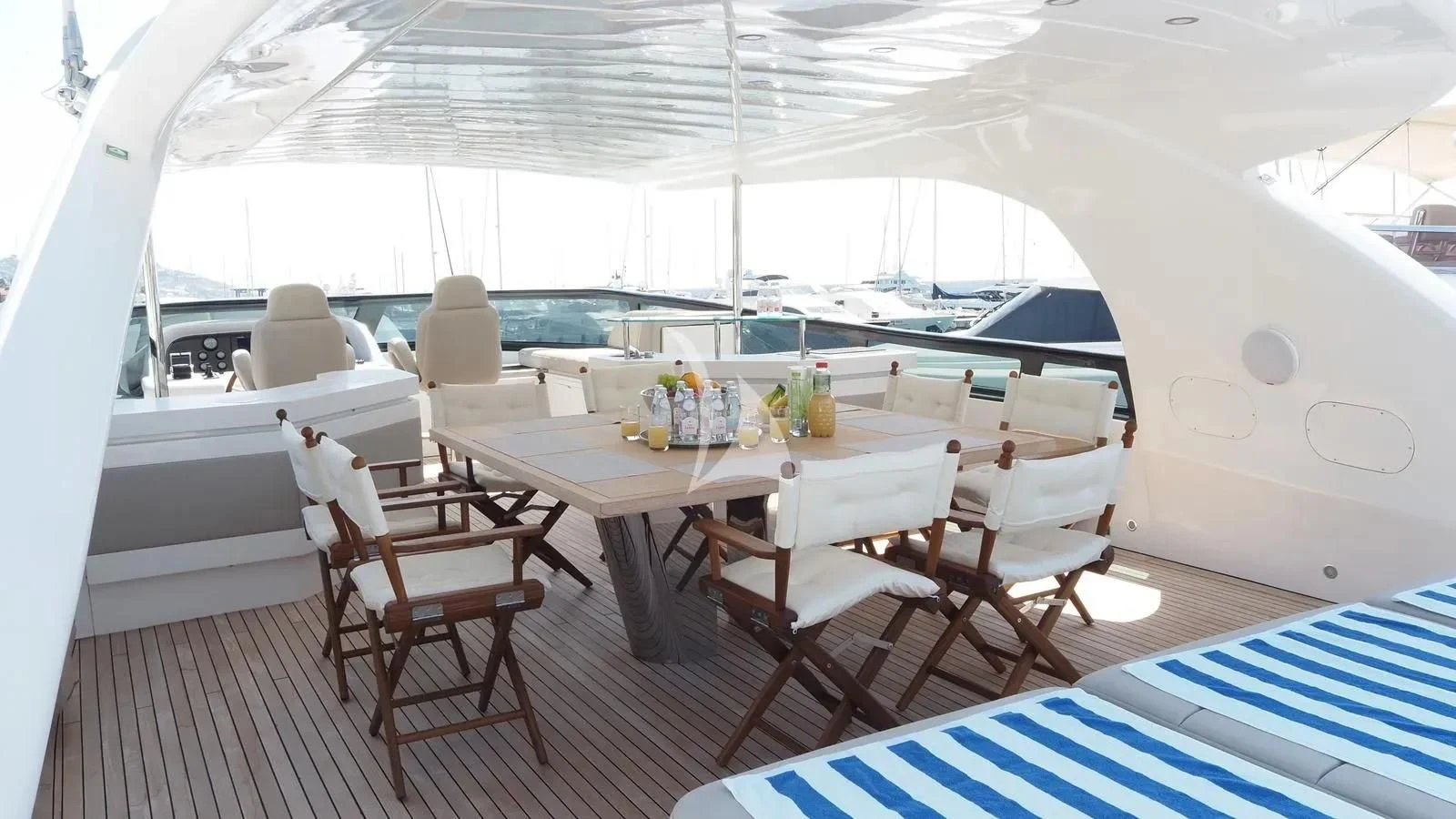 a room with a table and chairs aboard DADDY'S DREAM 888 Yacht for Charter