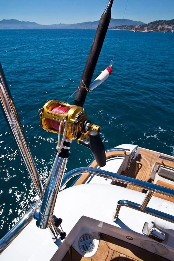 a boat with a paddle on the water aboard DADDY'S DREAM 888 Yacht for Charter