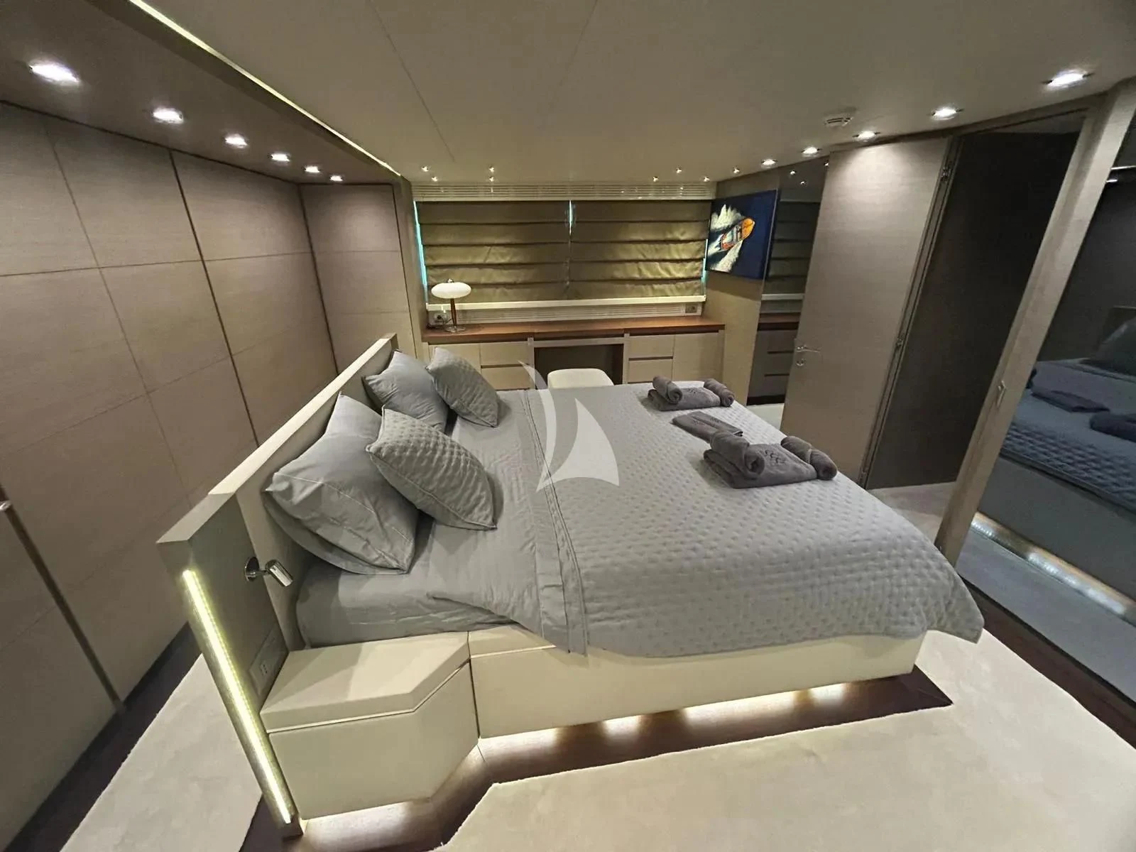 a bed with a white sheet and pillows on it aboard DADDY'S DREAM 888 Yacht for Charter