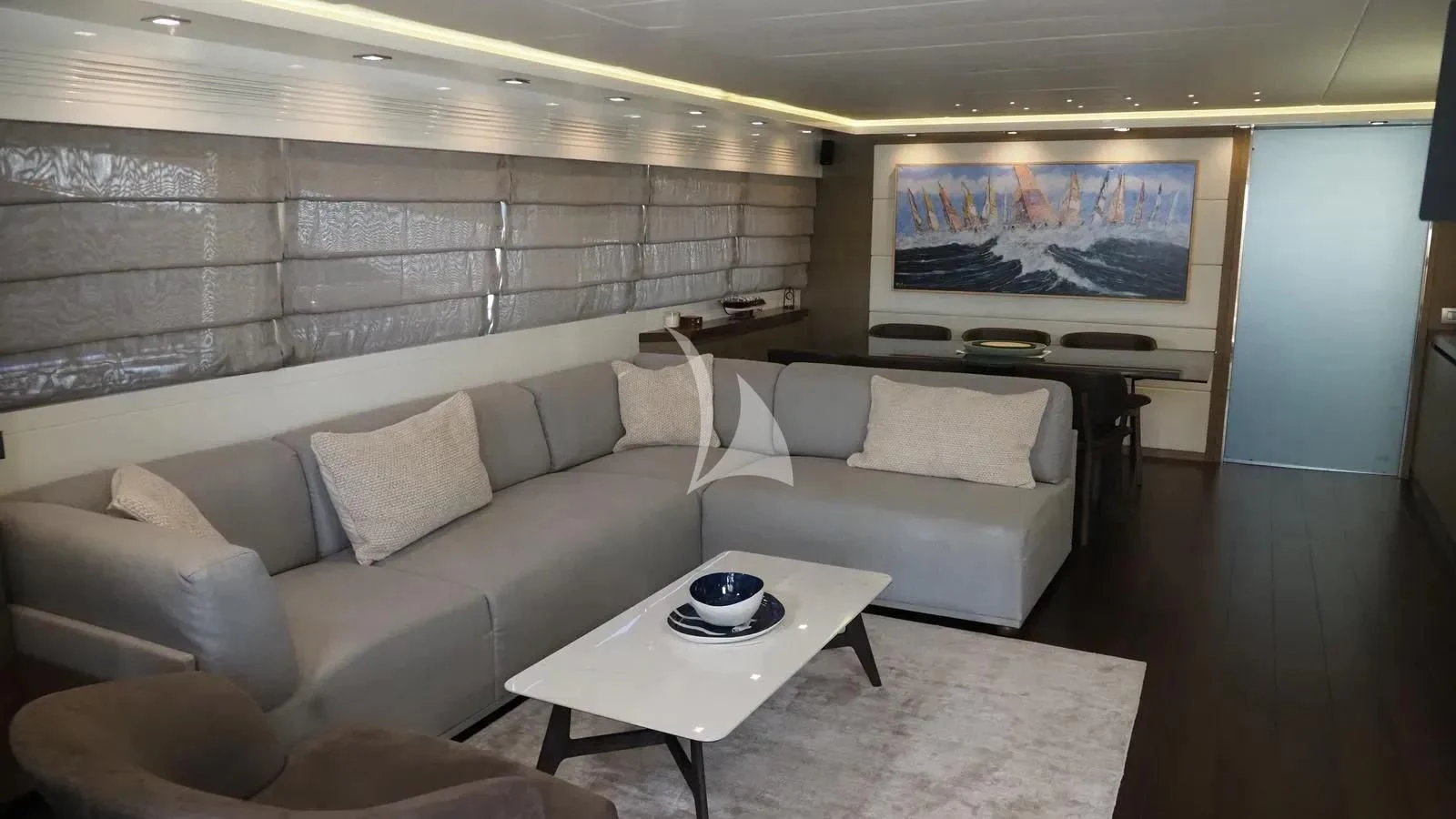 a room with couches and a television aboard DADDY'S DREAM 888 Yacht for Charter