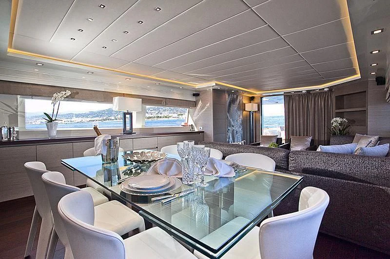 a large dining room with a table aboard DADDY'S DREAM 888 Yacht for Charter
