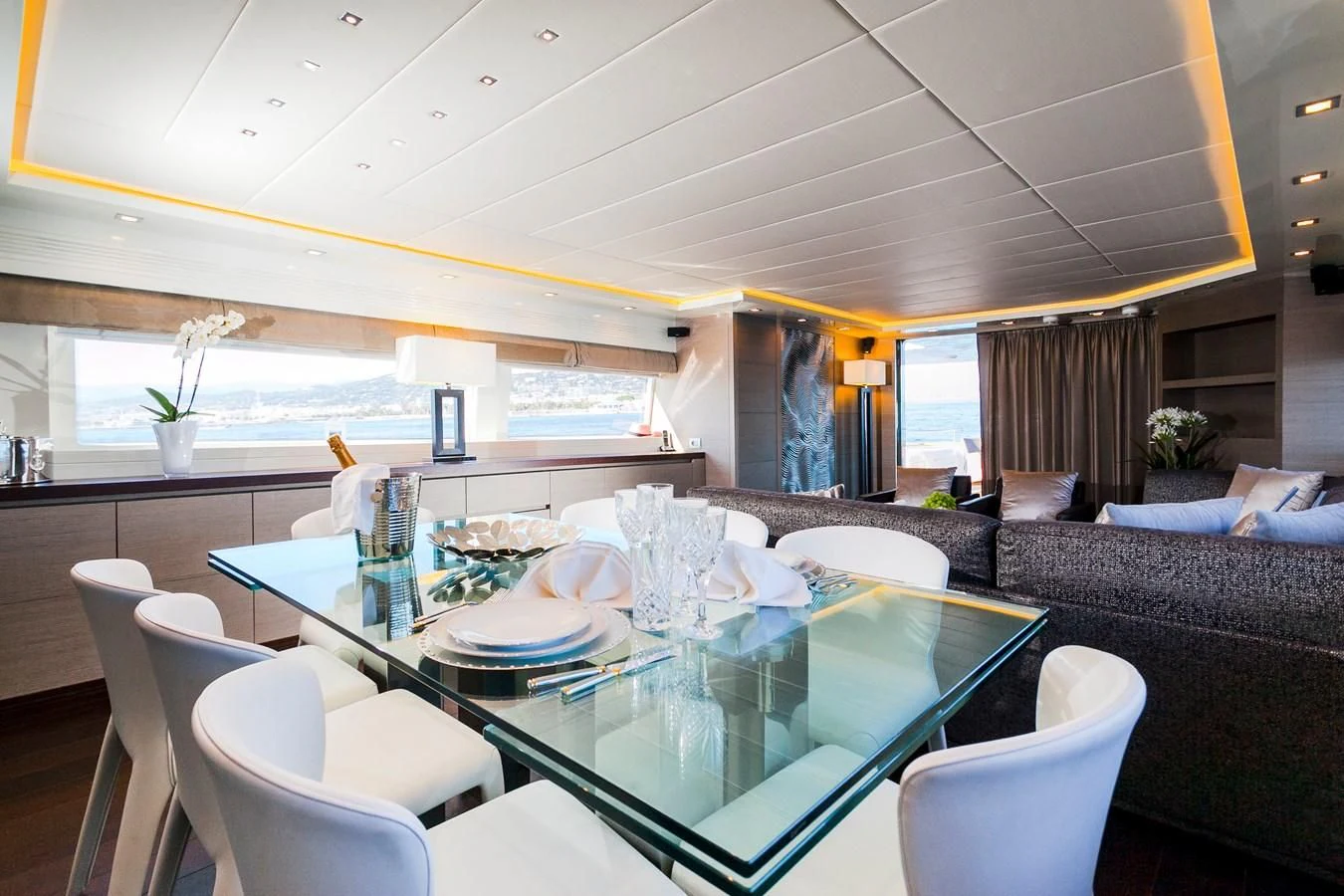 a large dining room with a large table and chairs aboard DADDY'S DREAM 888 Yacht for Charter