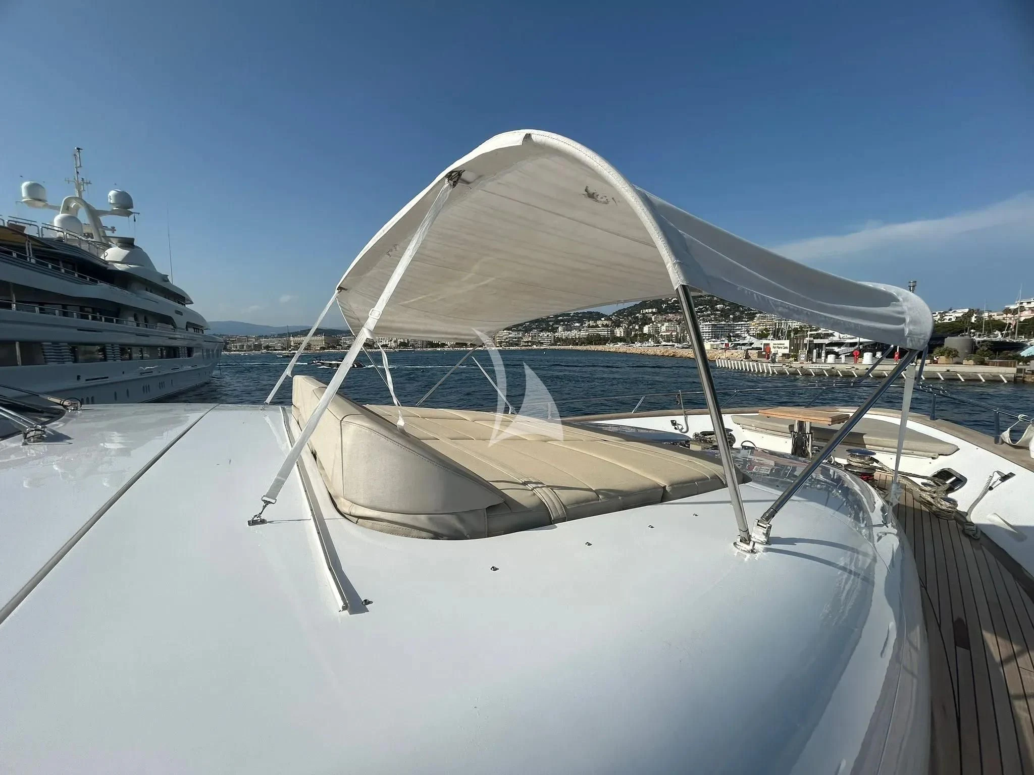 a white boat with a white canopy aboard DADDY'S DREAM 888 Yacht for Charter