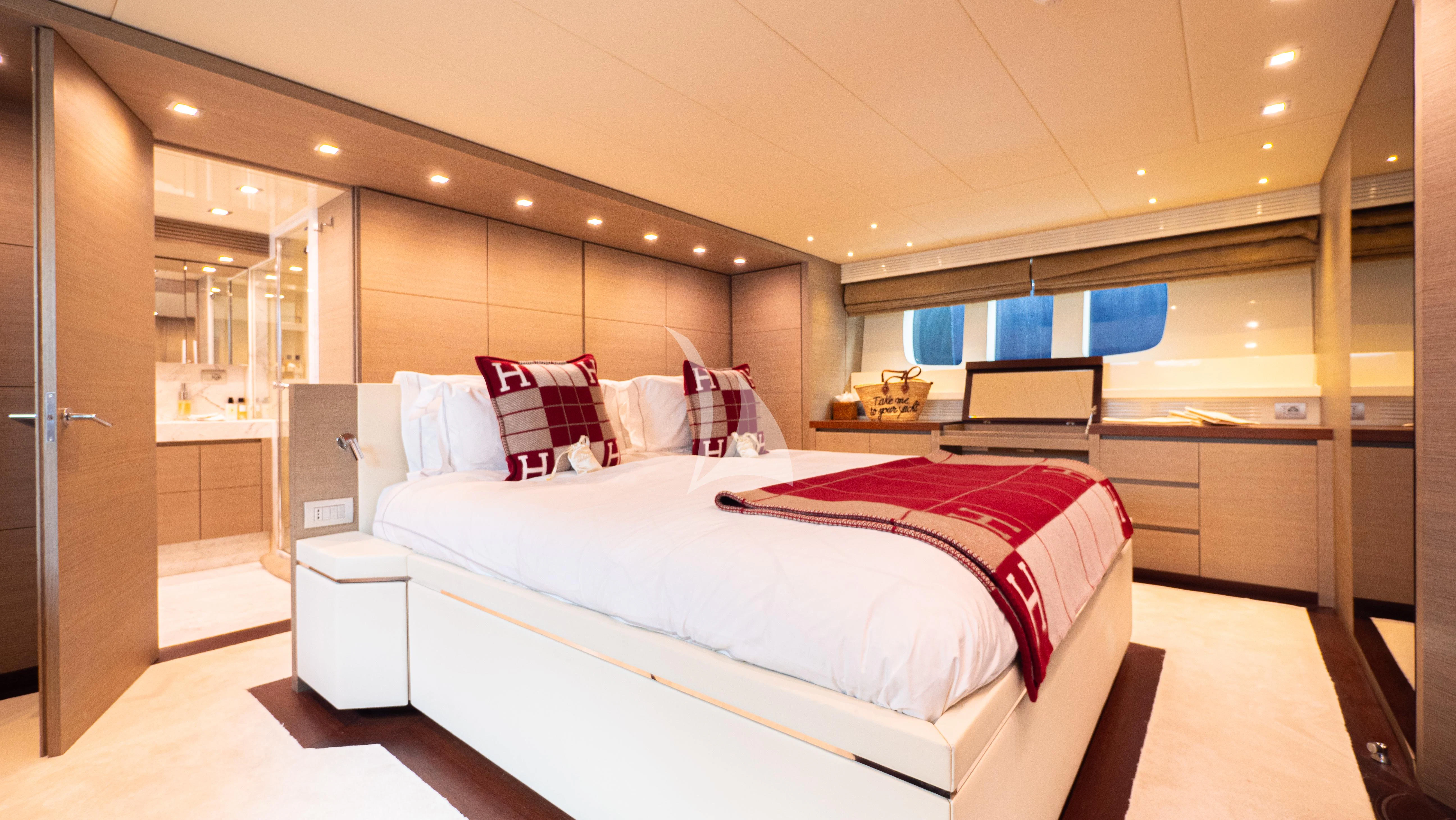 a large bedroom with a bed aboard DADDY'S DREAM 888 Yacht for Charter