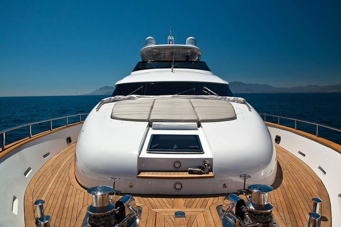 a large white yacht on a deck aboard DADDY'S DREAM 888 Yacht for Charter