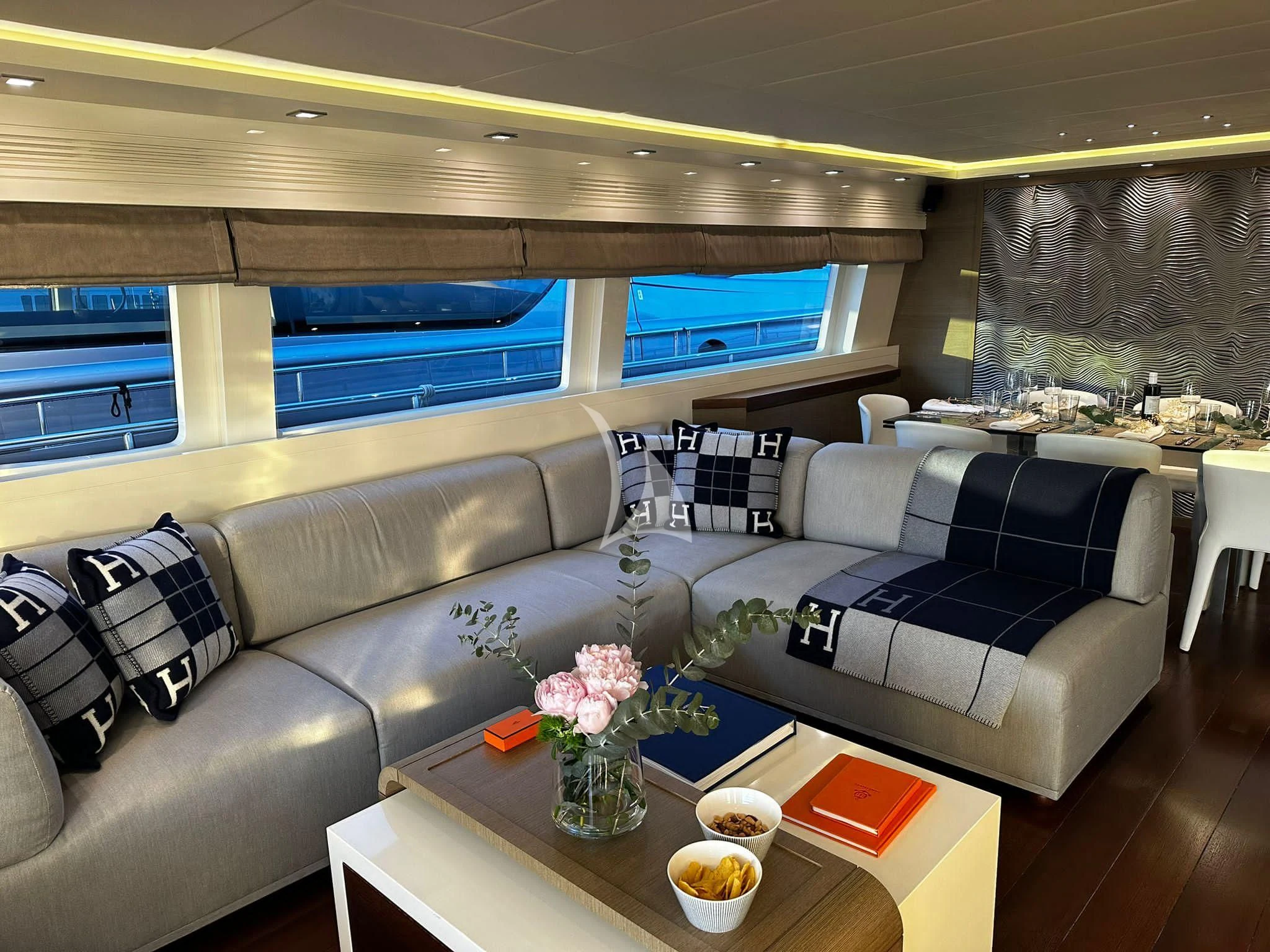 a living room with a couch and a table aboard DADDY'S DREAM 888 Yacht for Charter