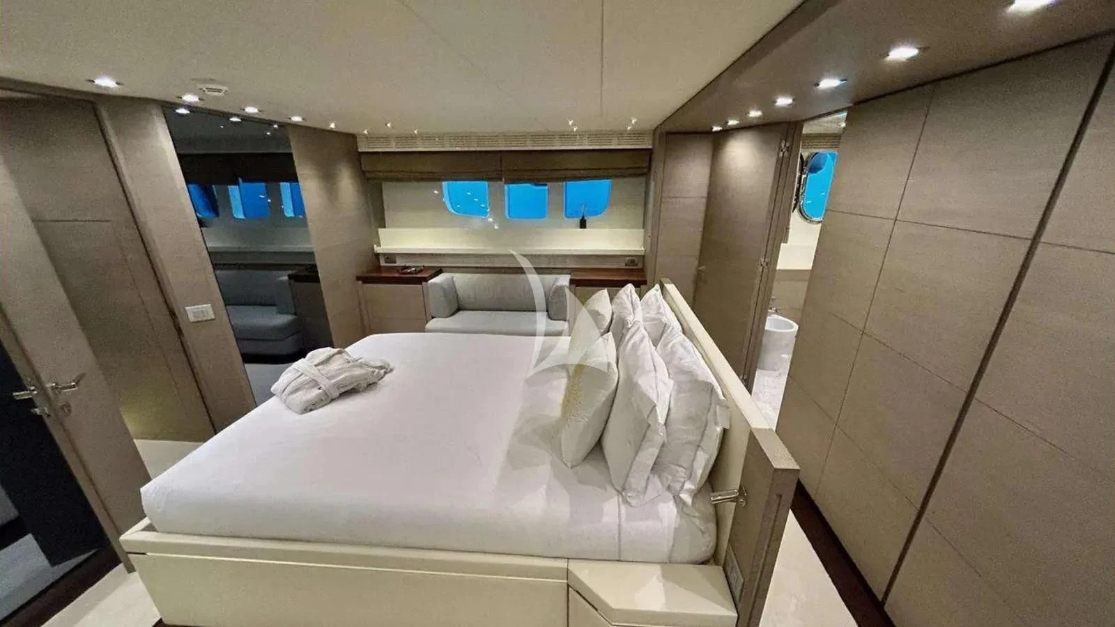a room with a bed and a chair aboard DADDY'S DREAM 888 Yacht for Charter