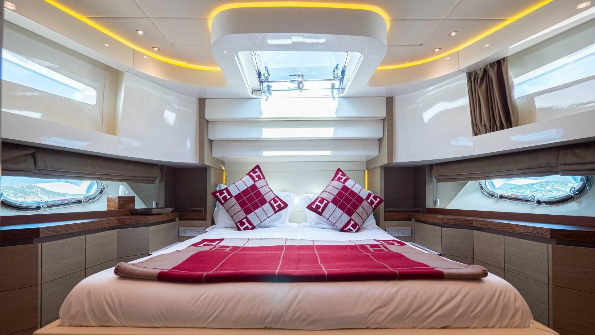 a bed with pillows on it aboard DADDY'S DREAM 888 Yacht for Charter