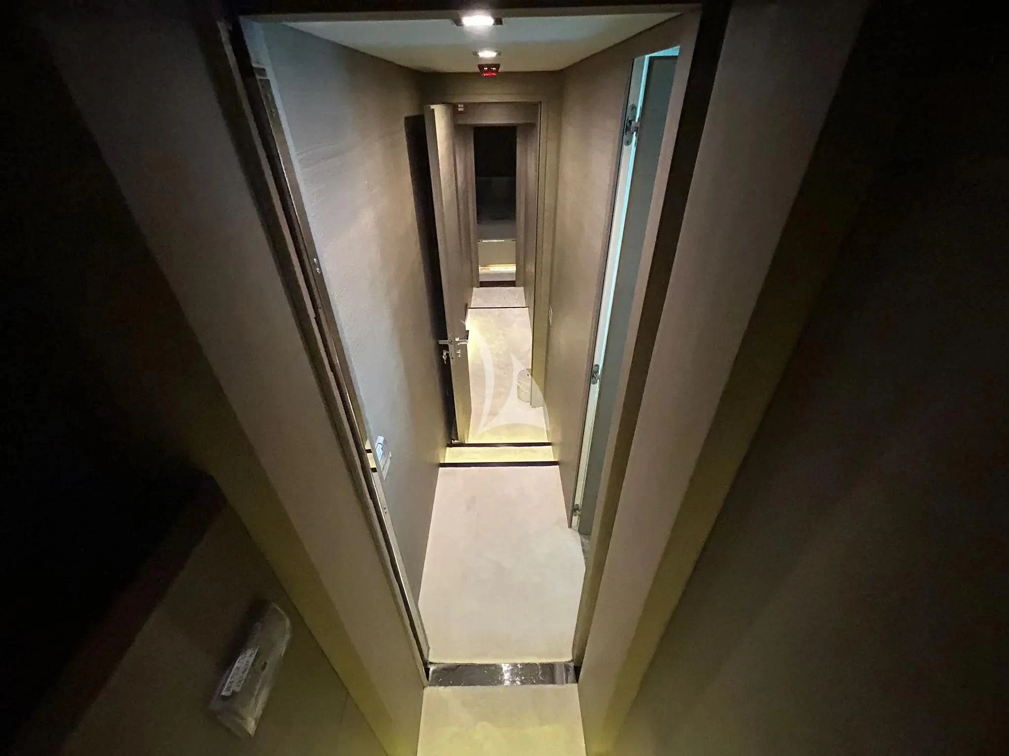a hallway with a door aboard DADDY'S DREAM 888 Yacht for Charter