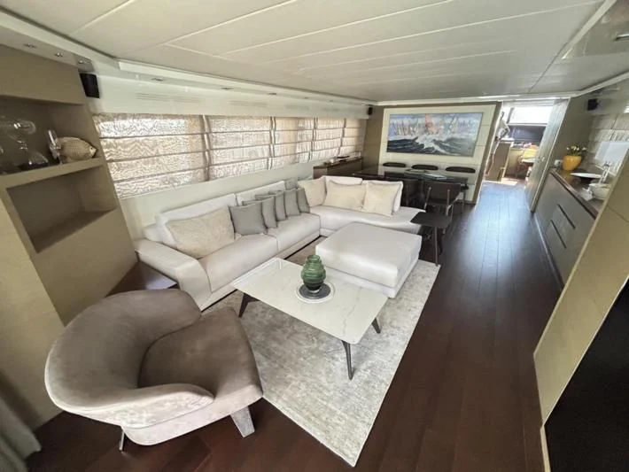 a living room with a large window aboard DADDY'S DREAM 888 Yacht for Charter