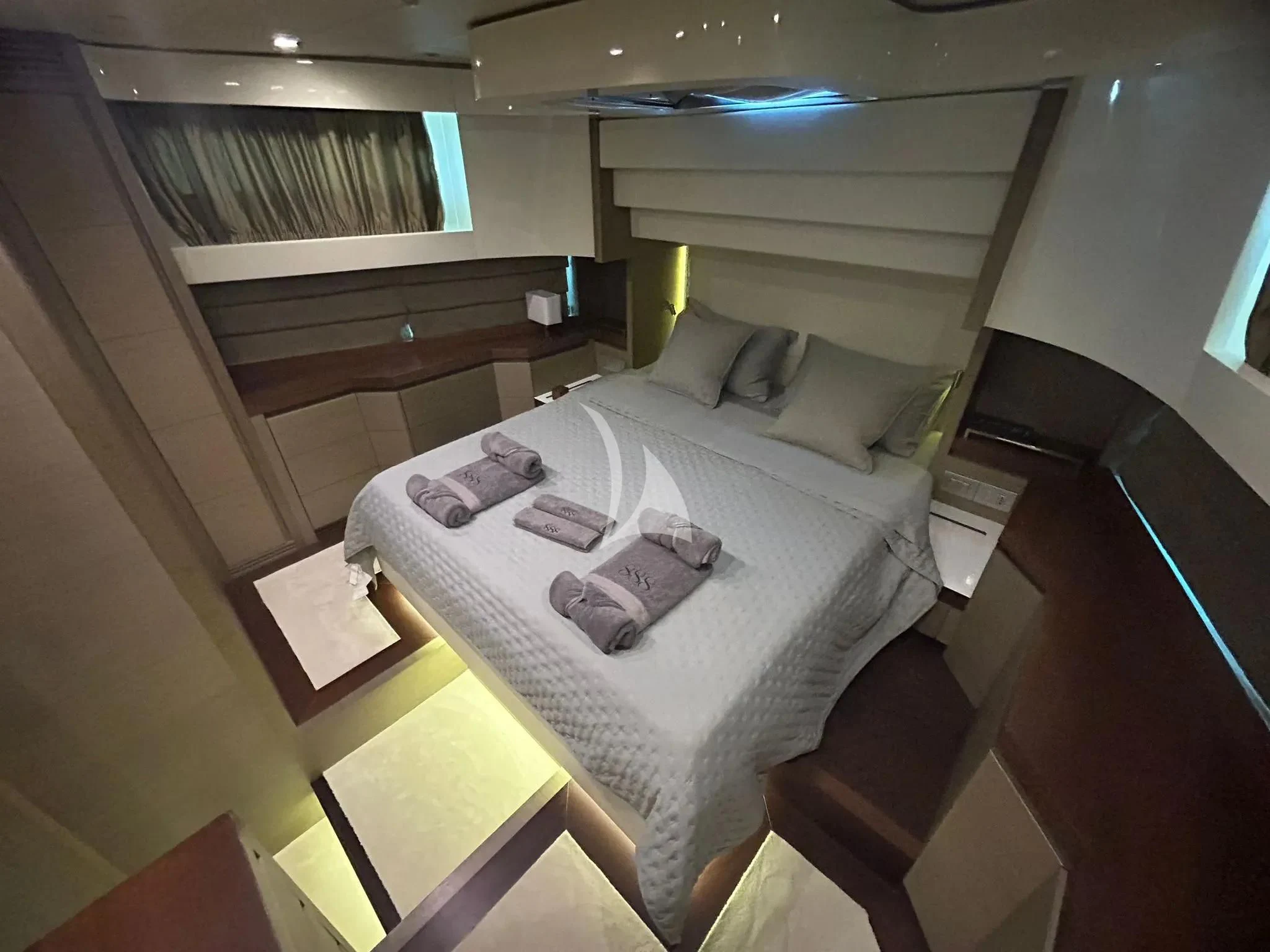 a bed with a white sheet aboard DADDY'S DREAM 888 Yacht for Charter